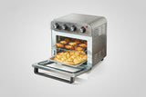 Toaster oven with food inside on a white background