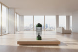 Green bottle with a person's face on it, likely a product or promotional item.