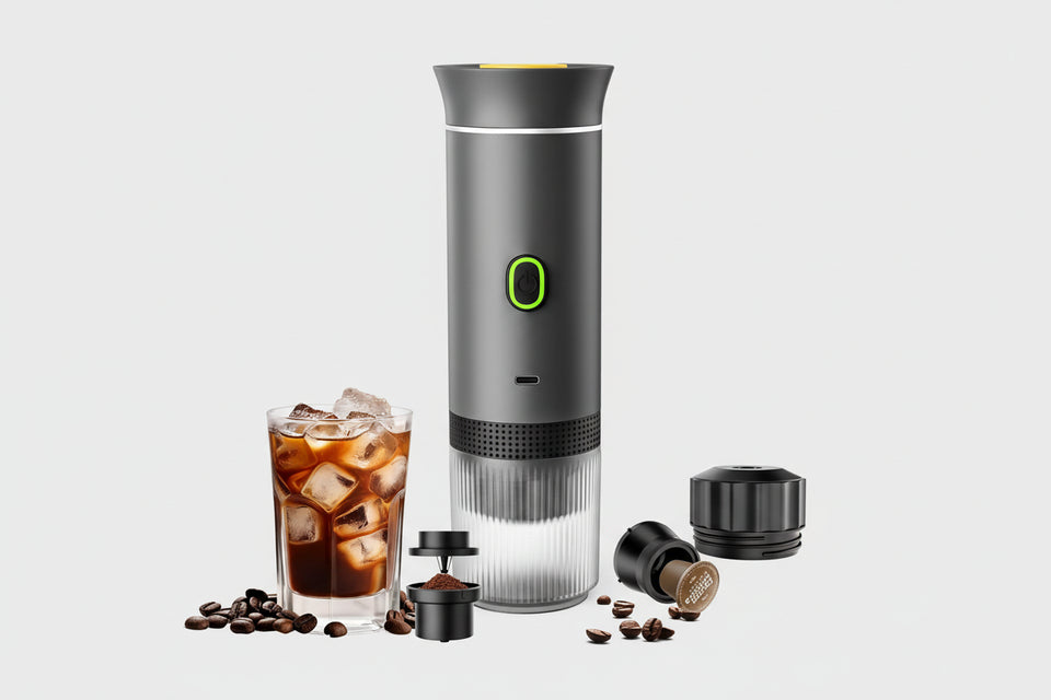 Coffee maker with attachments and a glass of iced coffee on a white background