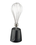 Black whisk with metal handle on a white background, featuring the 